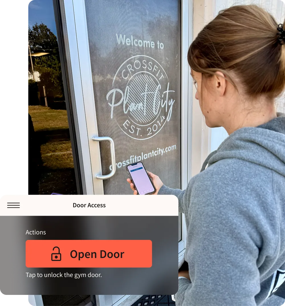 A woman uses the Wodify app on her phone to unlock the door of a CrossFit gym.